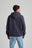 Personne portant un hoodie zippé Organic Essential en Trendsplant Blue, vue de dos | TP_IMAGE_TYPE=MODEL_BACK