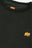 Détail en gros plan du sweat Organic Essential en Scarab Green avec un logo éléphant jaune sur la poitrine | TP_IMAGE_TYPE=DETAIL