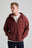 Persona che indossa Essential Zip Hoodie in Andorra Brown con chiusura lampo e cappuccio, abbinato a una t-shirt bianca sotto. | TP_IMAGE_TYPE=MODEL_FRONT