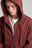 Persona che indossa Essential Zip Hoodie in Andorra Brown, con cappuccio e cerniera frontale. | TP_IMAGE_TYPE=MODEL_FRONT
