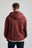 Persona che indossa una Essential Zip Hoodie in Andorra Brown, con vista posteriore del design elegante e confortevole. | TP_IMAGE_TYPE=MODEL_BACK
