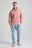 Person wearing an Essential Sunwashed Quarter Zip Sweatshirt in Old Rose, styled with light blue jeans and sneakers. | TP_IMAGE_TYPE=MODEL_FRONT