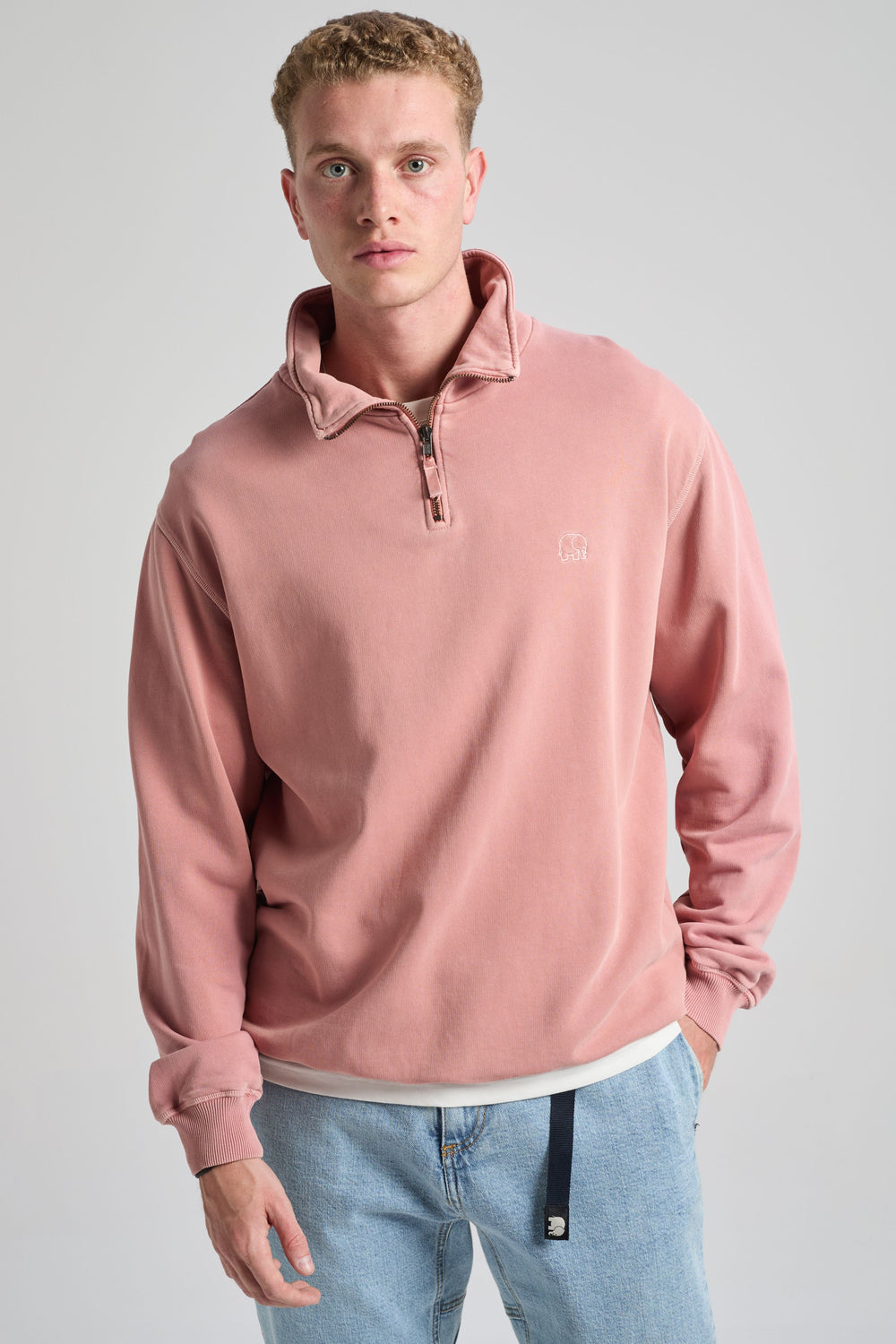 Person wearing an Essential Sunwashed Quarter Zip Sweatshirt in Old Rose, featuring a quarter zip design and a relaxed fit. | TP_IMAGE_TYPE=MODEL_FRONT