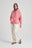 Persona che indossa una Felpa con Cappuccio Zip Oversized Essentials Organic da Donna in Rossette Pink, vista frontale | TP_IMAGE_TYPE=MODEL_FRONT