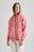 Persona che indossa una Felpa con Cappuccio Zip Oversized Essentials Organic da Donna in Rossette Pink, vista frontale | TP_IMAGE_TYPE=MODEL_FRONT
