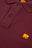Dettaglio ravvicinato della Polo Shirt Essentials Organic Burgundy con bottoni e logo elefante ricamato | TP_IMAGE_TYPE=DETAIL