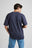 Personne portant l’Essential T-Shirt en Parisian Blue, vue de dos | TP_IMAGE_TYPE=MODEL_BACK