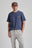 Persona che indossa una Organic Essential T-Shirt in Trendsplant Blue, vista frontale | TP_IMAGE_TYPE=MODEL_FRONT