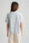 Persona che indossa una t-shirt Pearl Blue, vista posteriore | TP_IMAGE_TYPE=MODEL_BACK