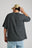 Personne portant un t-shirt oversize en tissu épais, coloris Pirate Black, vue de dos, ajustant une casquette. | TP_IMAGE_TYPE=MODEL_BACK