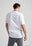 Persona che indossa una Organic Essential T-Shirt bianca, vista posteriore | TP_IMAGE_TYPE=MODEL_BACK