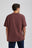 Person wearing Essential T-Shirt in Puce Purple, back view | TP_IMAGE_TYPE=MODEL_BACK