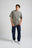 Person wearing an Essential T-Shirt in Brushed Nickel color, styled with dark jeans and white sneakers | TP_IMAGE_TYPE=MODEL_FRONT
