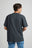 Person wearing an Essential T-Shirt in Bitumen Grey, viewed from the back | TP_IMAGE_TYPE=MODEL_BACK