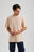 Personne portant l'Essential Sunwashed T-Shirt en gris fumée, coupe décontractée et encolure ras du cou. | TP_IMAGE_TYPE=MODEL_FRONT