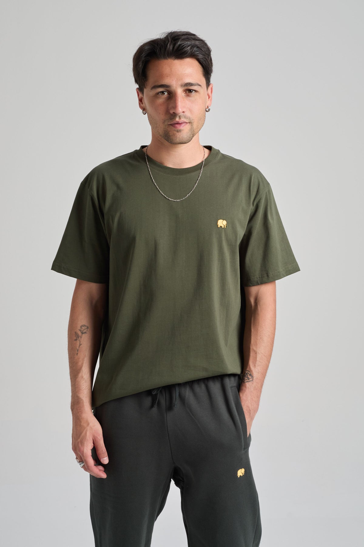 Person wearing an Organic Essential T-Shirt in Kombu Green front view | TP_IMAGE_TYPE=MODEL_FRONT