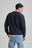 Persona che indossa un blazer in maglia Sella blu navy, vista posteriore | TP_IMAGE_TYPE=MODEL_BACK