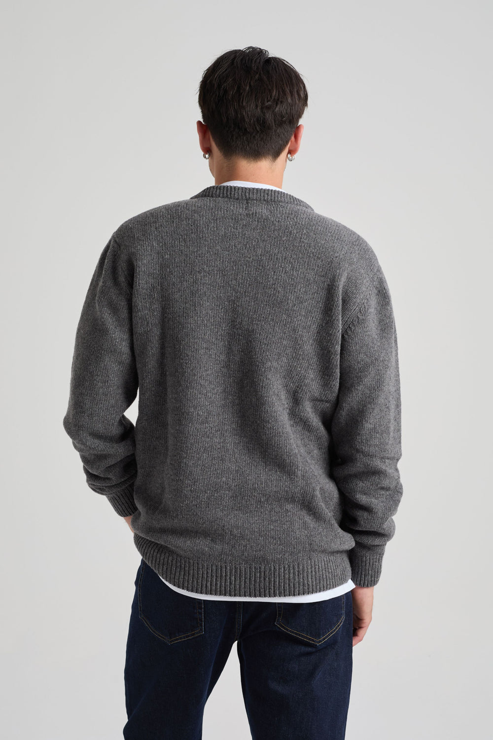 Person wearing a Sella Knit Dark Heather Grey sweater back view | TP_IMAGE_TYPE=MODEL_BACK