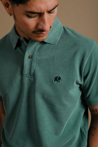 Person wearing an Organic Pigment Dyed Polo Shirt in Eden Green, front view | TP_IMAGE_TYPE=MODEL_FRONT