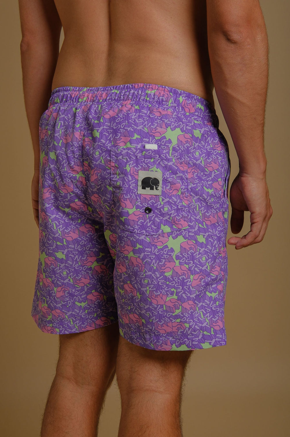 Person wearing Trippyplant Seaqual® Yarn Swim Short in Sour Grape, back view | TP_IMAGE_TYPE=MODEL_BACK