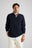 Personne portant le Bernia Quarter Zip Knit en Ocean Blue avec une chemise à col en dessous, les mains dans les poches | TP_IMAGE_TYPE=MODEL_FRONT