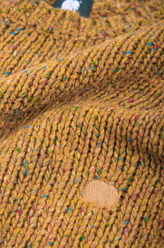 Close-up detail of the Maigmo Knit in Dijon color showcasing the textured knit and patch design. | TP_IMAGE_TYPE=DETAIL