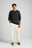 Persona che indossa un maglione Tarbena Knit Charcoal con un outfit casual, in piedi su uno sfondo neutro. | TP_IMAGE_TYPE=MODEL_FRONT