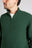 Personne portant un Bernia Quarter Zip Knit en coloris Forest, avec col côtelé et fermeture à glissière. | TP_IMAGE_TYPE=MODEL_FRONT
