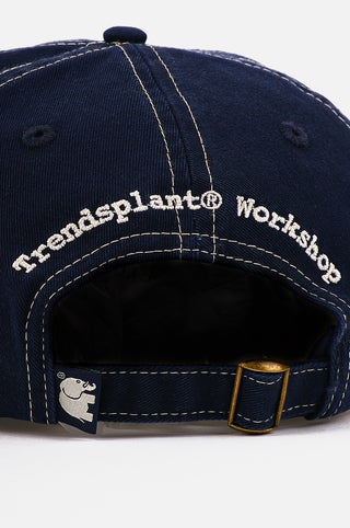 Detail view of the Dockyard Canvas Cap in Mood Indigo showcasing the embroidered logo and adjustable strap | TP_IMAGE_TYPE=DETAIL