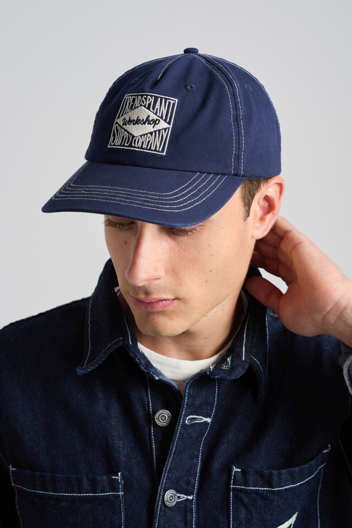 Person wearing a Dockyard Canvas Cap Mood Indigo front view | TP_IMAGE_TYPE=MODEL_FRONT
