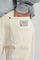 Person wearing Operator Relaxed Pants in Antique White, showing back pocket detail | TP_IMAGE_TYPE=DETAIL