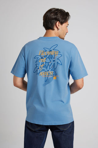 Person wearing a blue short-sleeved T-shirt with a floral graphic on the back | TP_IMAGE_TYPE=MODEL_BACK