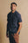 Personne portant un Organic Essential Polo Shirt en Trendsplant Blue, vue de face | TP_IMAGE_TYPE=MODEL_FRONT