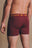 Persona che indossa Organic Essential Boxer Briefs Burgundy, vista posteriore | TP_IMAGE_TYPE=MODEL_BACK