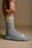 Person wearing grey organic cotton athletic socks, adjusting the sock | TP_IMAGE_TYPE=MODEL_FRONT