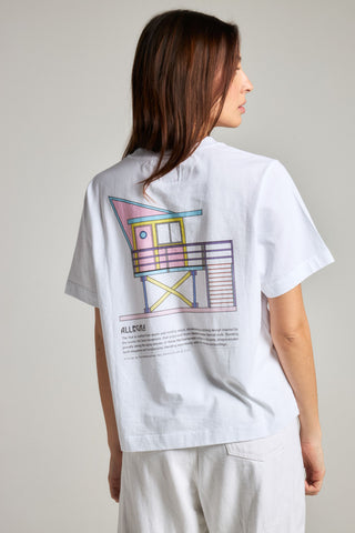 Person wearing a white t-shirt with colorful graphic design on the back | TP_IMAGE_TYPE=MODEL_BACK