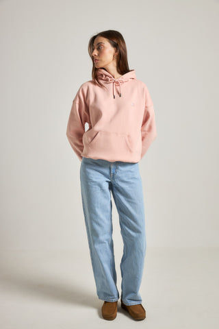 Personne portant un Women's Organic Essential Oversized Hoodie en rose pâle, vue de face | TP_IMAGE_TYPE=MODEL_FRONT