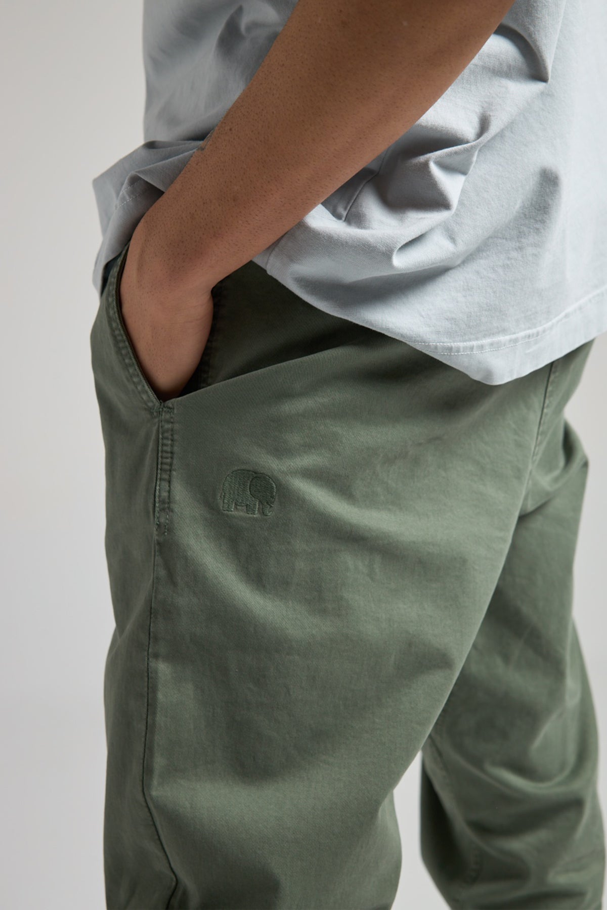 Person wearing Ecodye Cotton Climber Pant Menthol with hands in pockets | TP_IMAGE_TYPE=MODEL_FRONT
